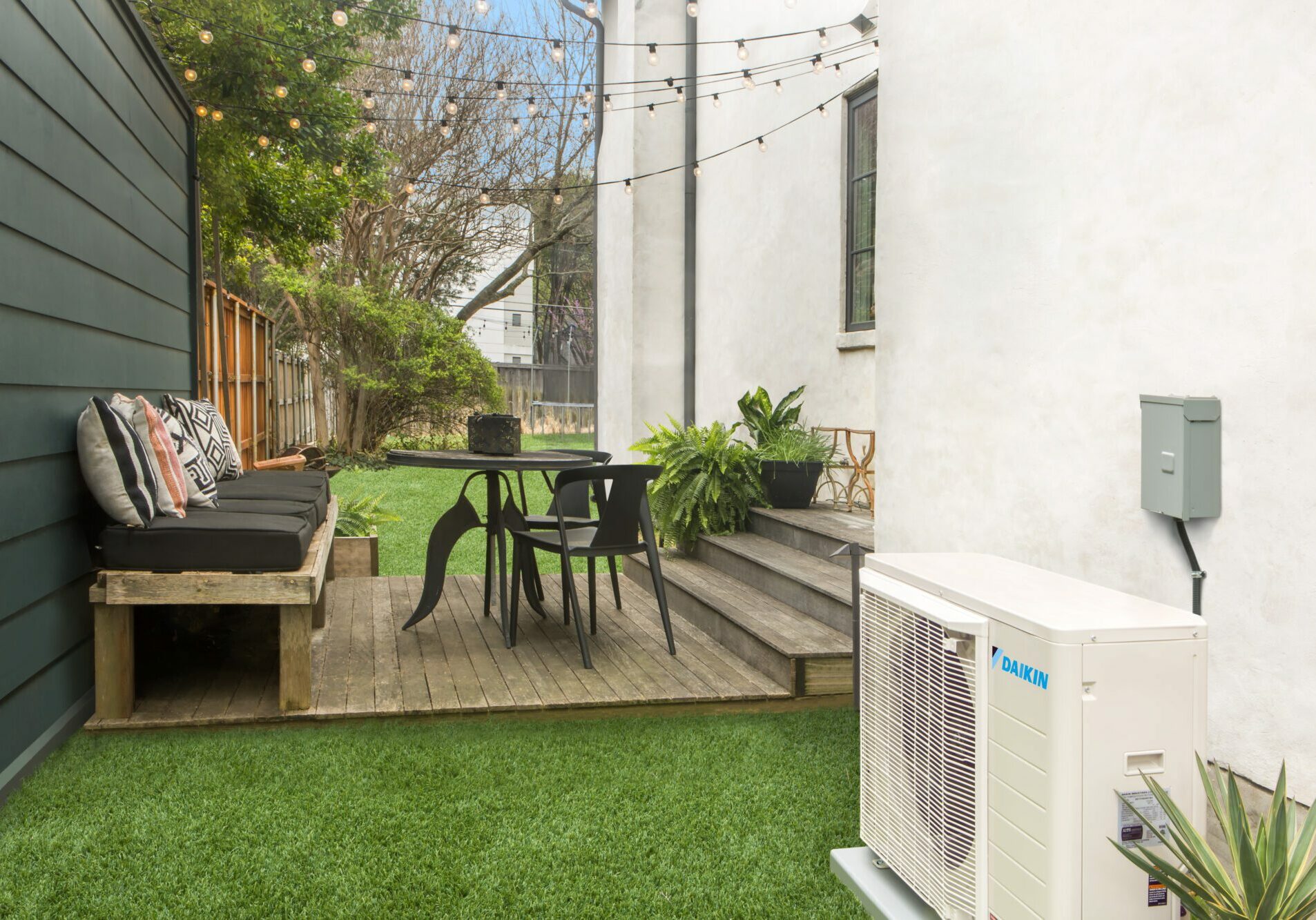 Compact Diakin FIT AC Unit in backyard